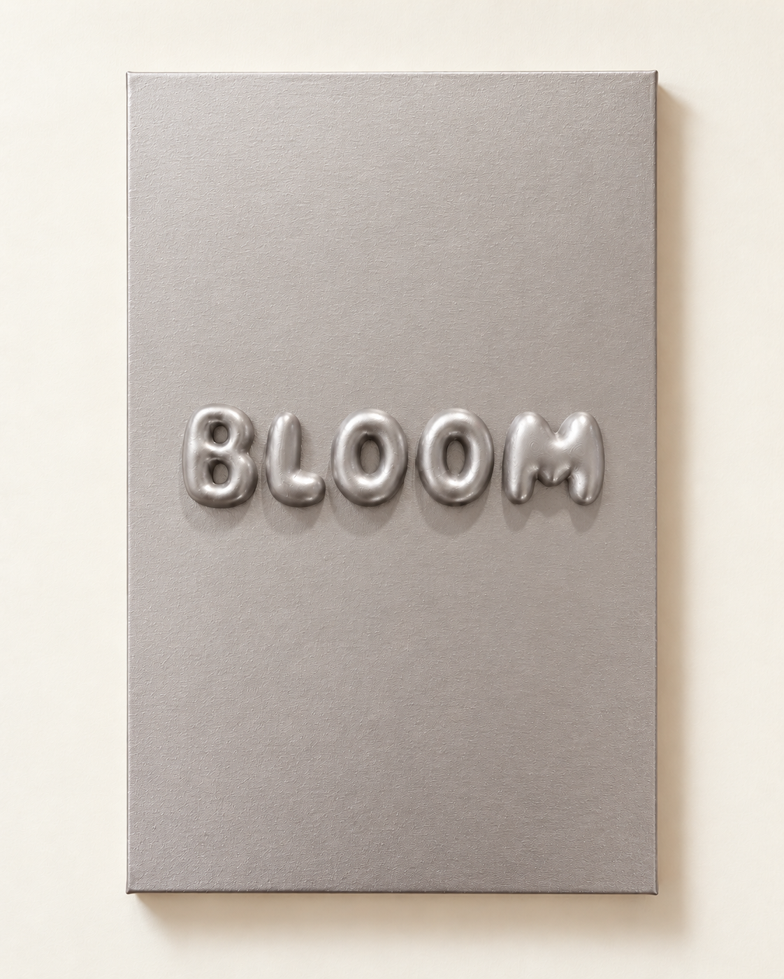 Studio presentation of the silver BLOOM raised-letter canvas, shown in 40 by 60 cm proportions